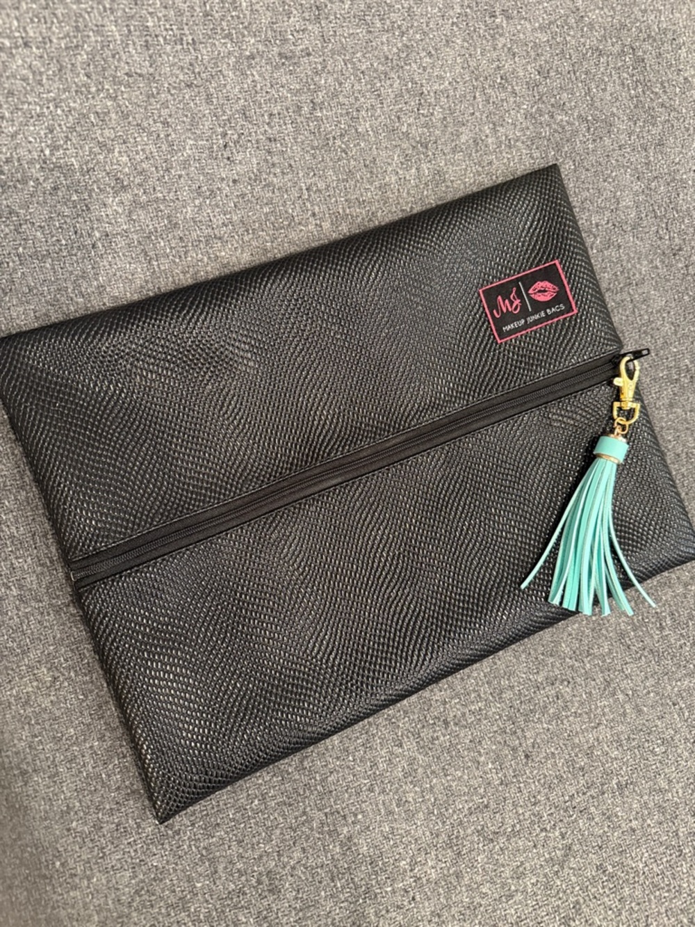 Makeup Junkie Black Textured Cosmetic Clutch with Mint Tassel